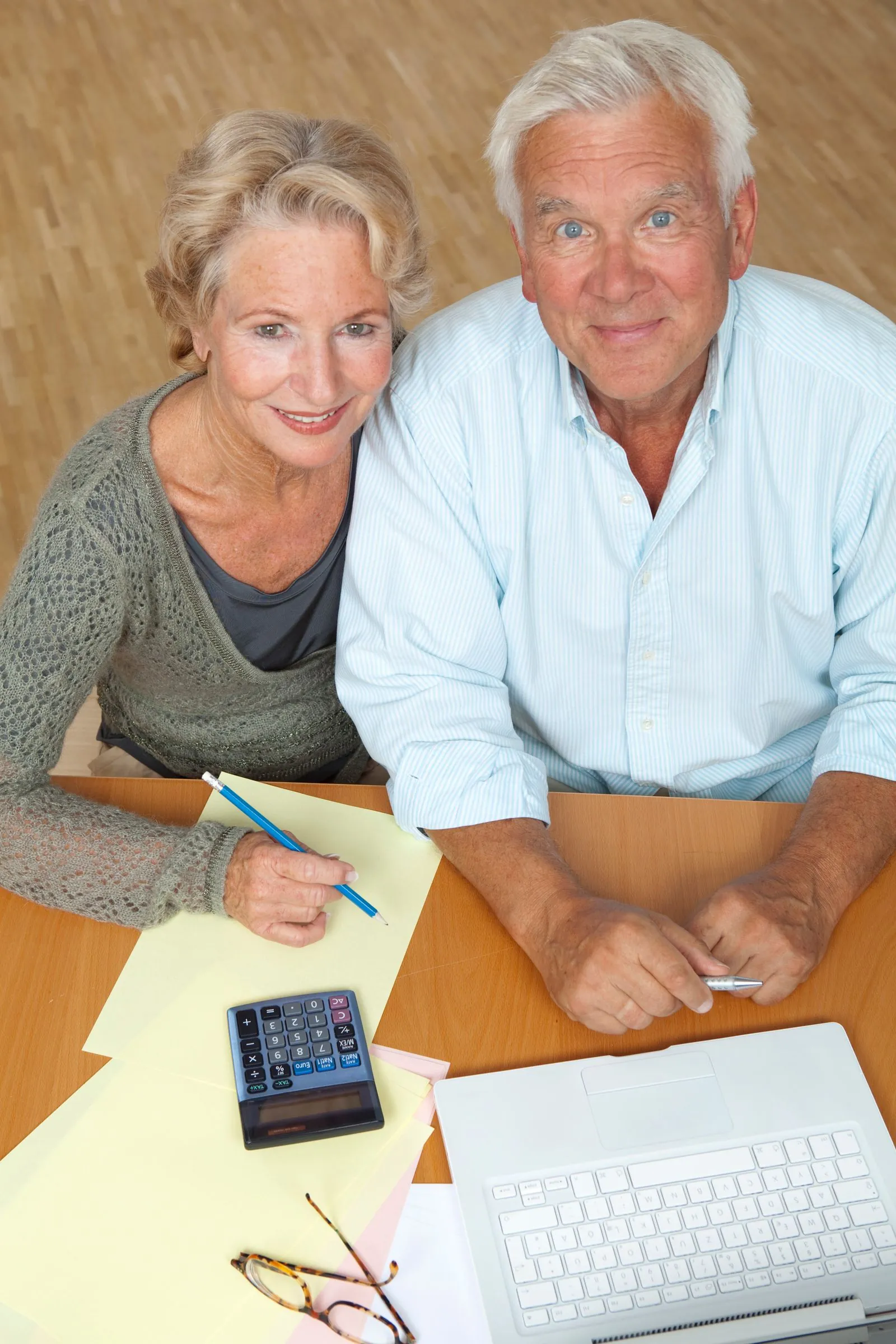 Florida land for retirement — a relaxed retired couple reviewing their finances at home